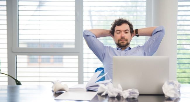 man-relaxing-working-place_23-2147656749